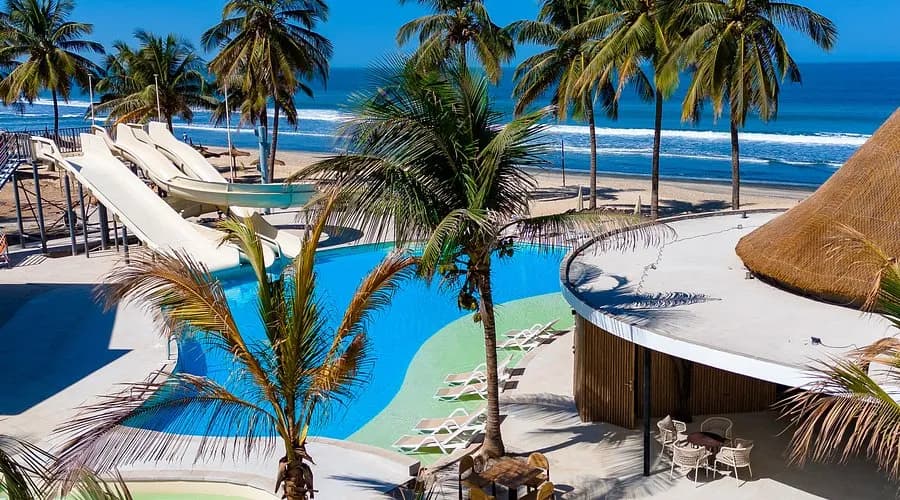 The pool and beachfront at Kombo Beach Hotel