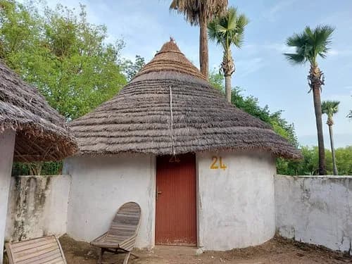 A thatched round hut at Hotel Campement Wassadou